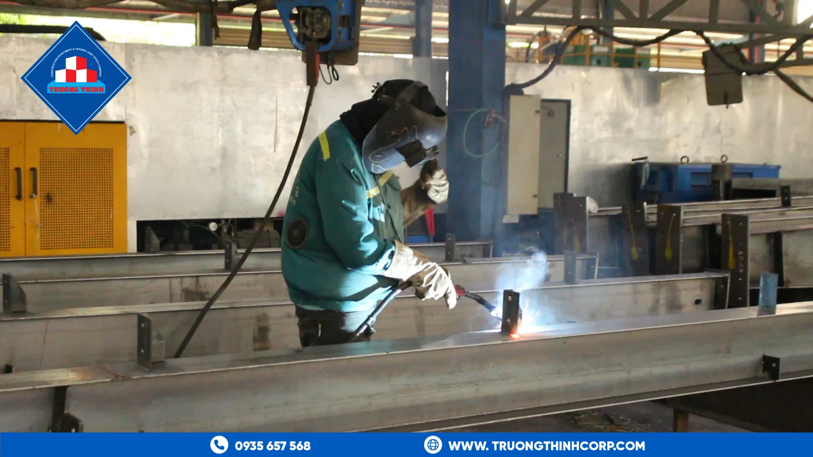 Finished welded steel column section with base plate at Truong Thinh Corp's fabrication factory