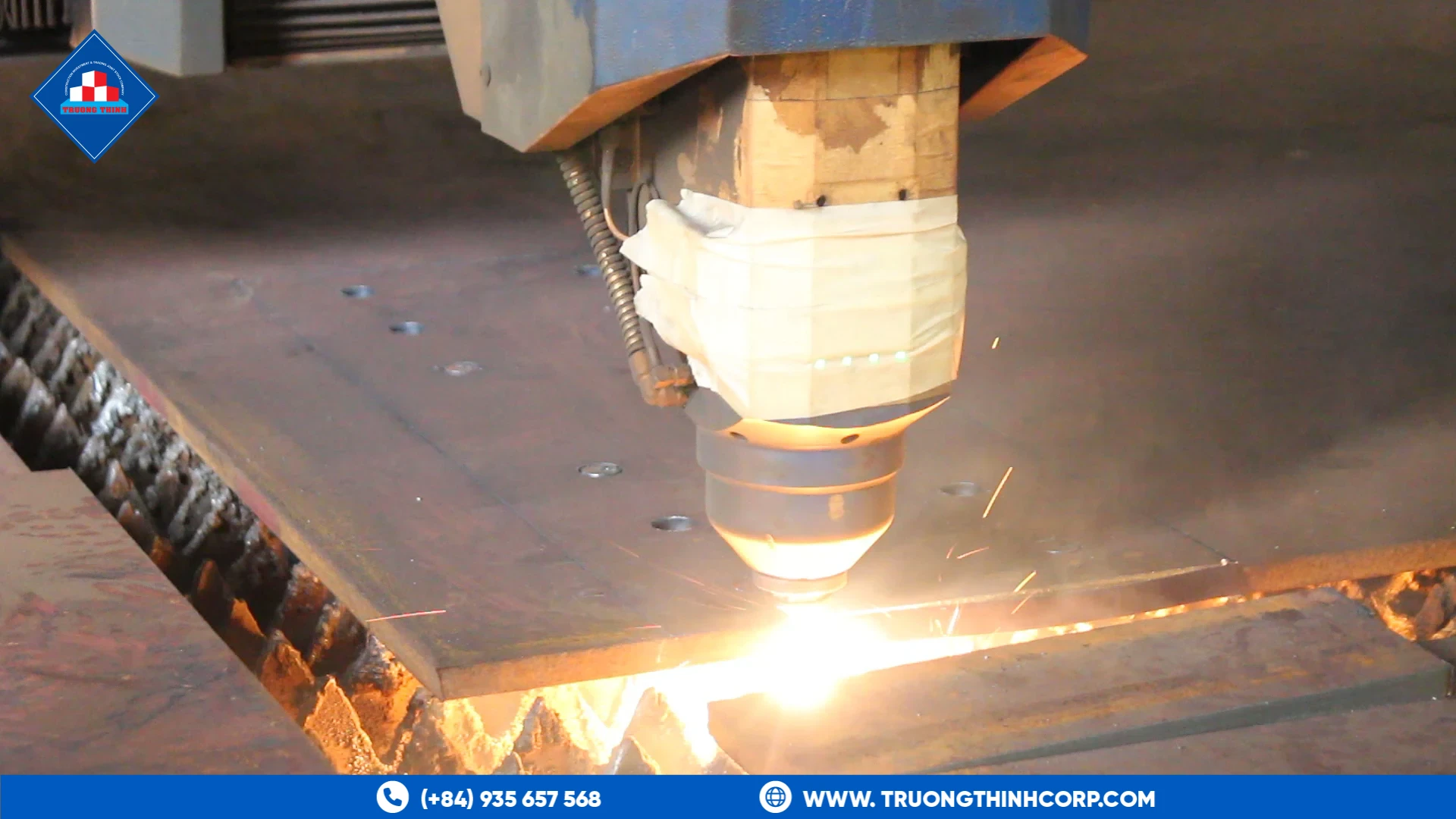CNC plasma cutting with sparks on structural steel plate at Truong Thinh Corp