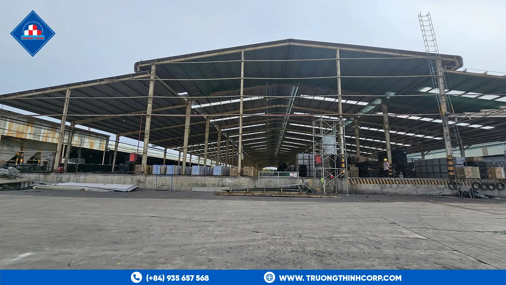 Exterior of a large steel-frame warehouse at the Royal House factory project