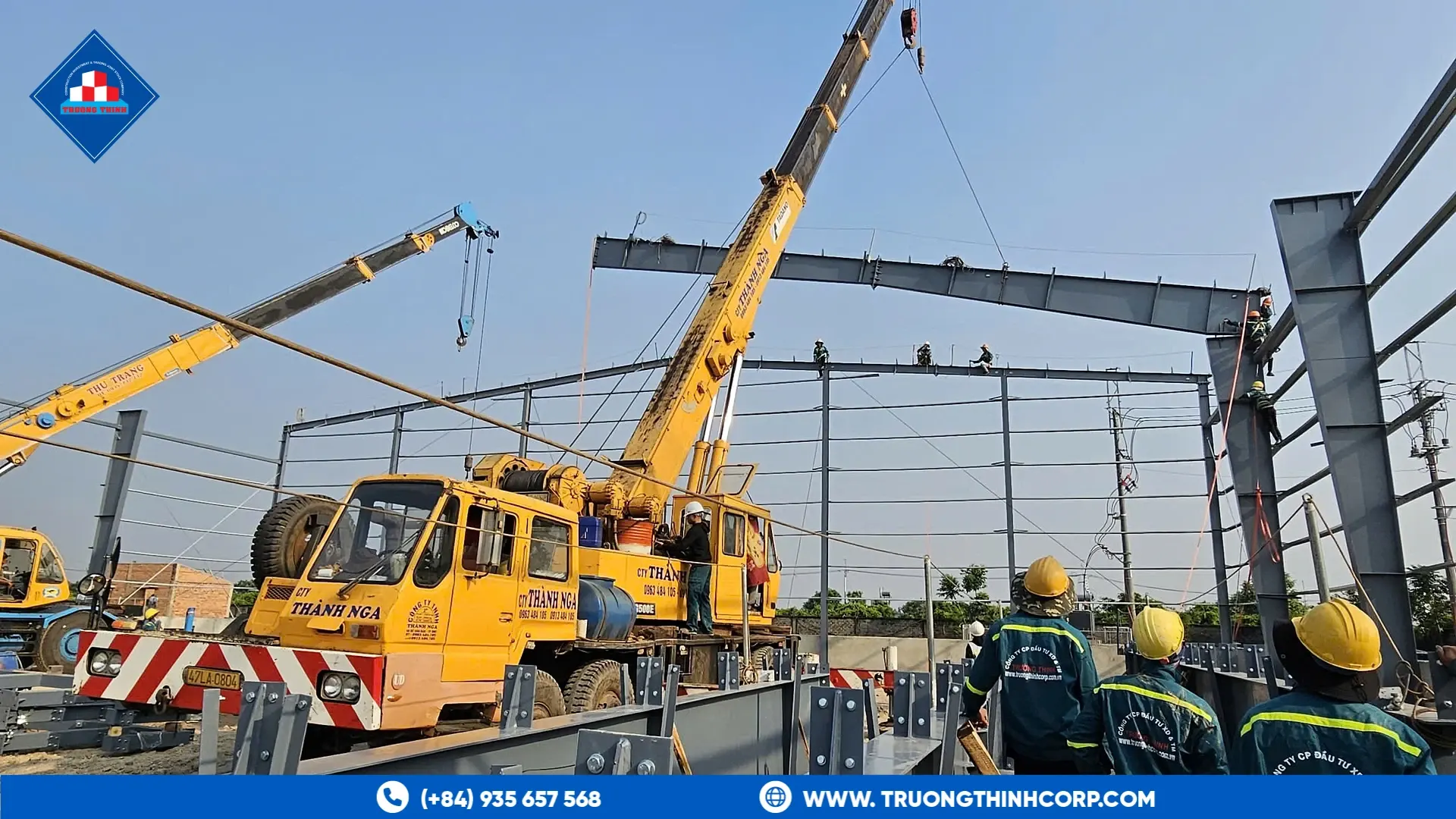 Mobile cranes lifting steel roof frames at the Highland Star animal feed factory project
