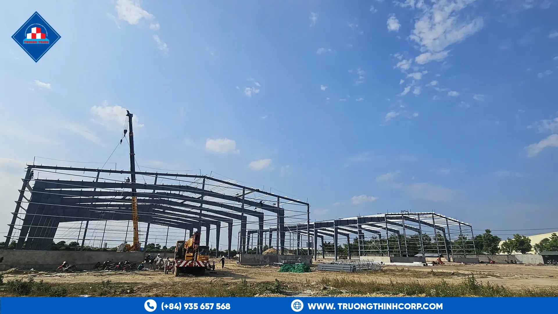 Steel portal frames rising above the site at the Highland Star feed mill project