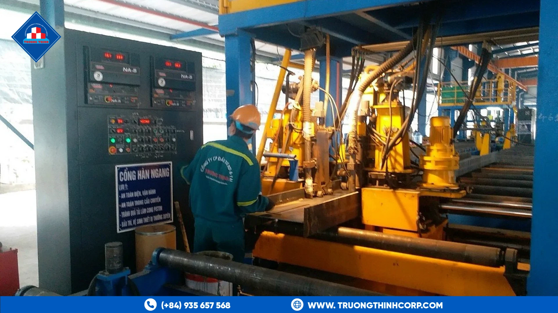 Operator at an automatic welding line control panel at Truong Thinh Corp's factory