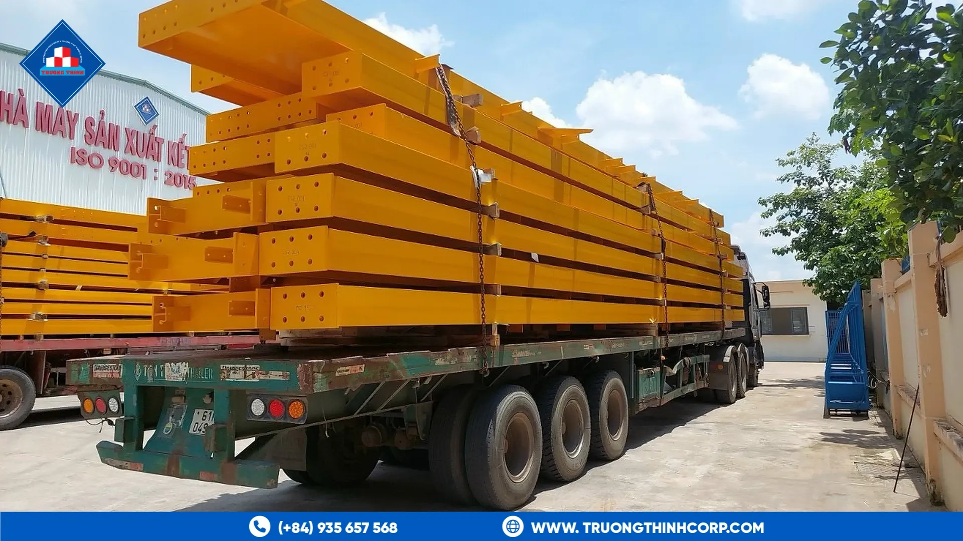 Orange-primed steel members loaded on a truck at Truong Thinh Corp's factory