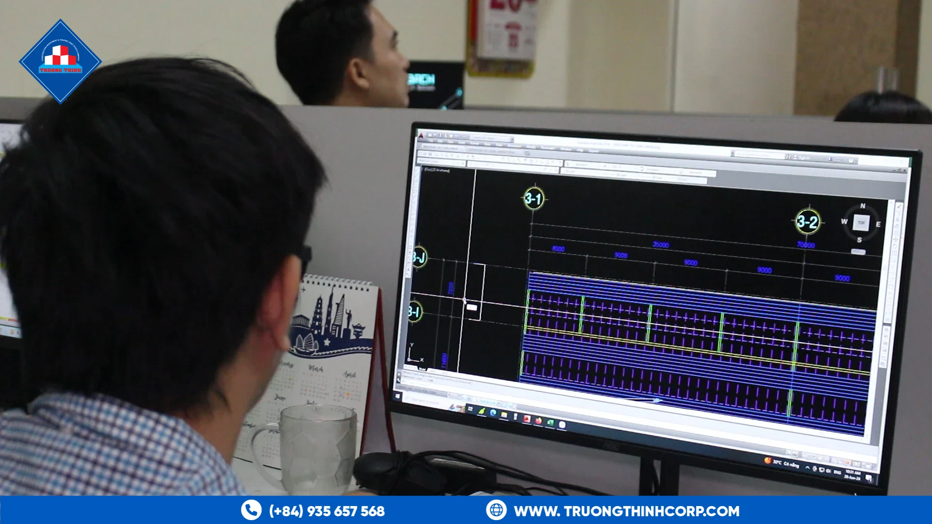 Engineer reviewing structural steel shop drawings on a CAD workstation at Truong Thinh Corp