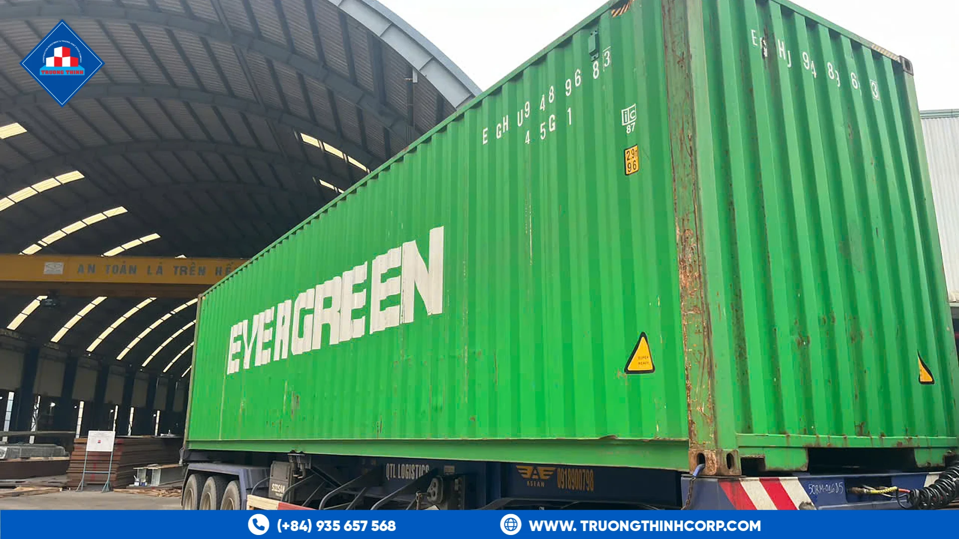 Container truck carrying fabricated steel structures for export at Truong Thinh Corp