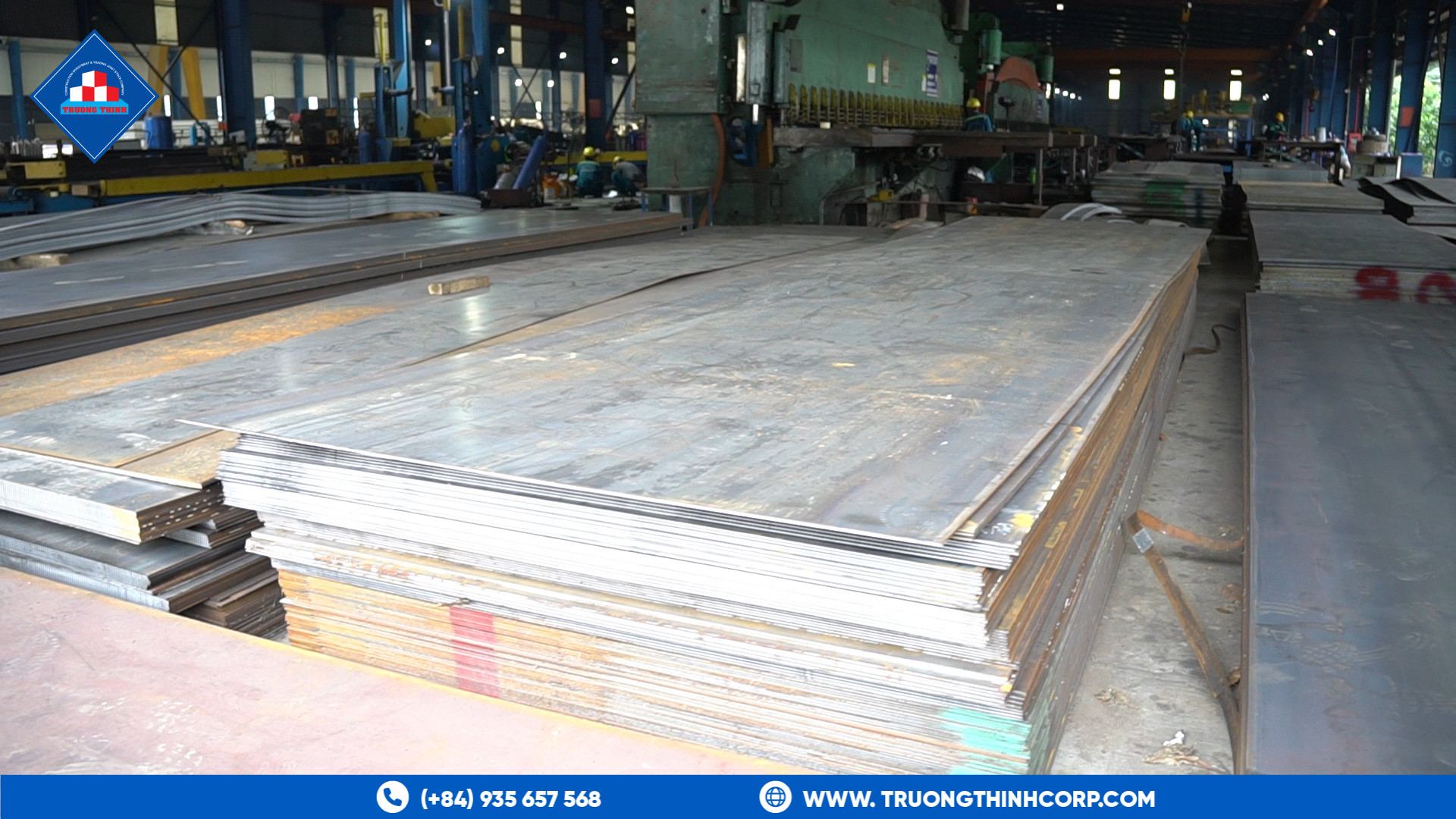 Stacked steel plates in the factory yard ready for cutting