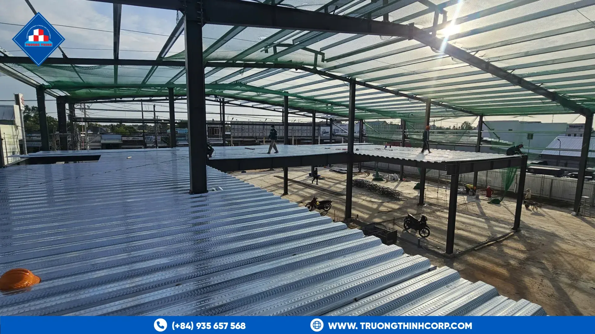 Steel floor decking and structural framing during construction of the BYD Ca Mau showroom by Truong Thinh Corp