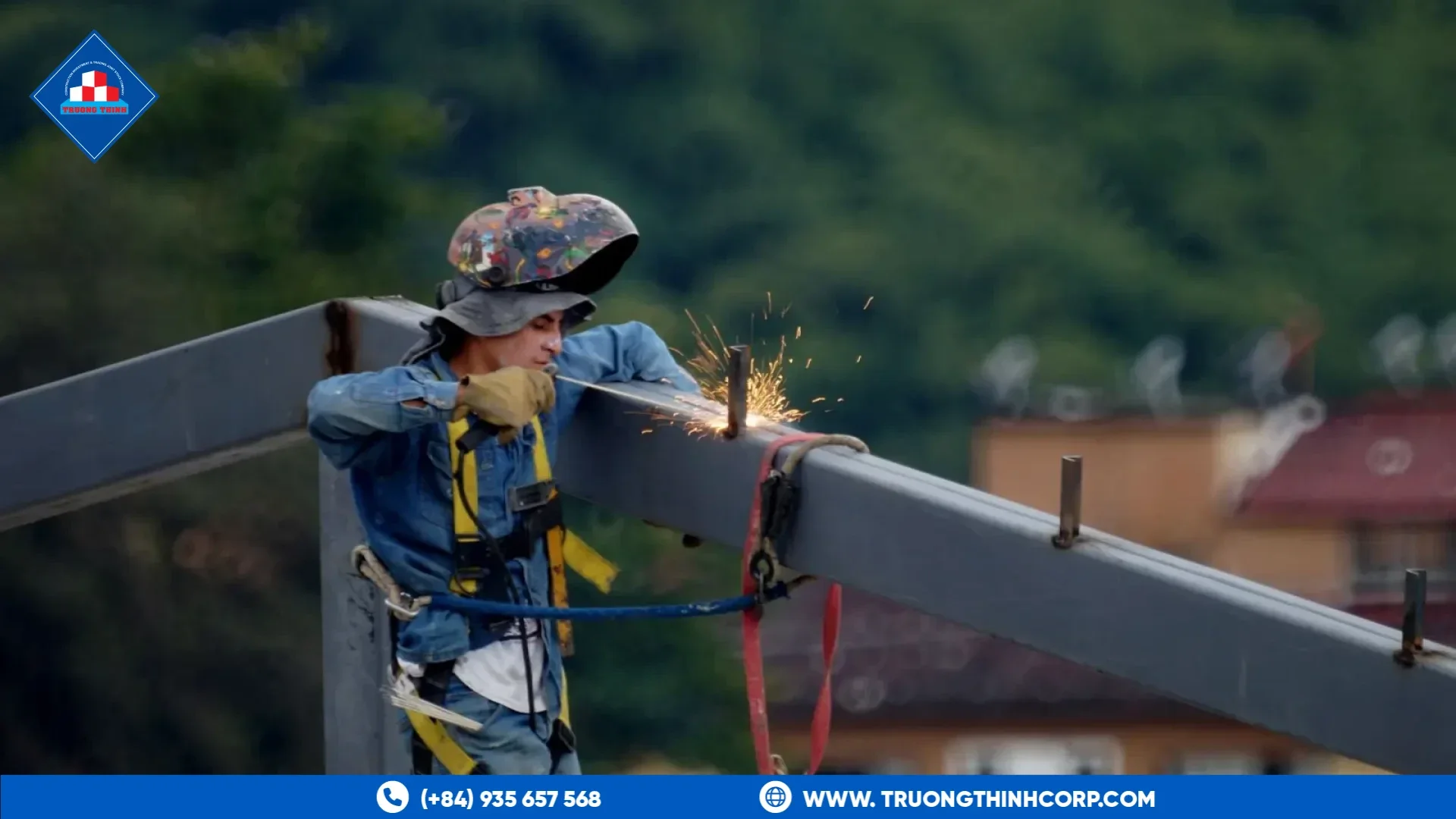 Welder joining a structural steel beam connection under a controlled welding procedure