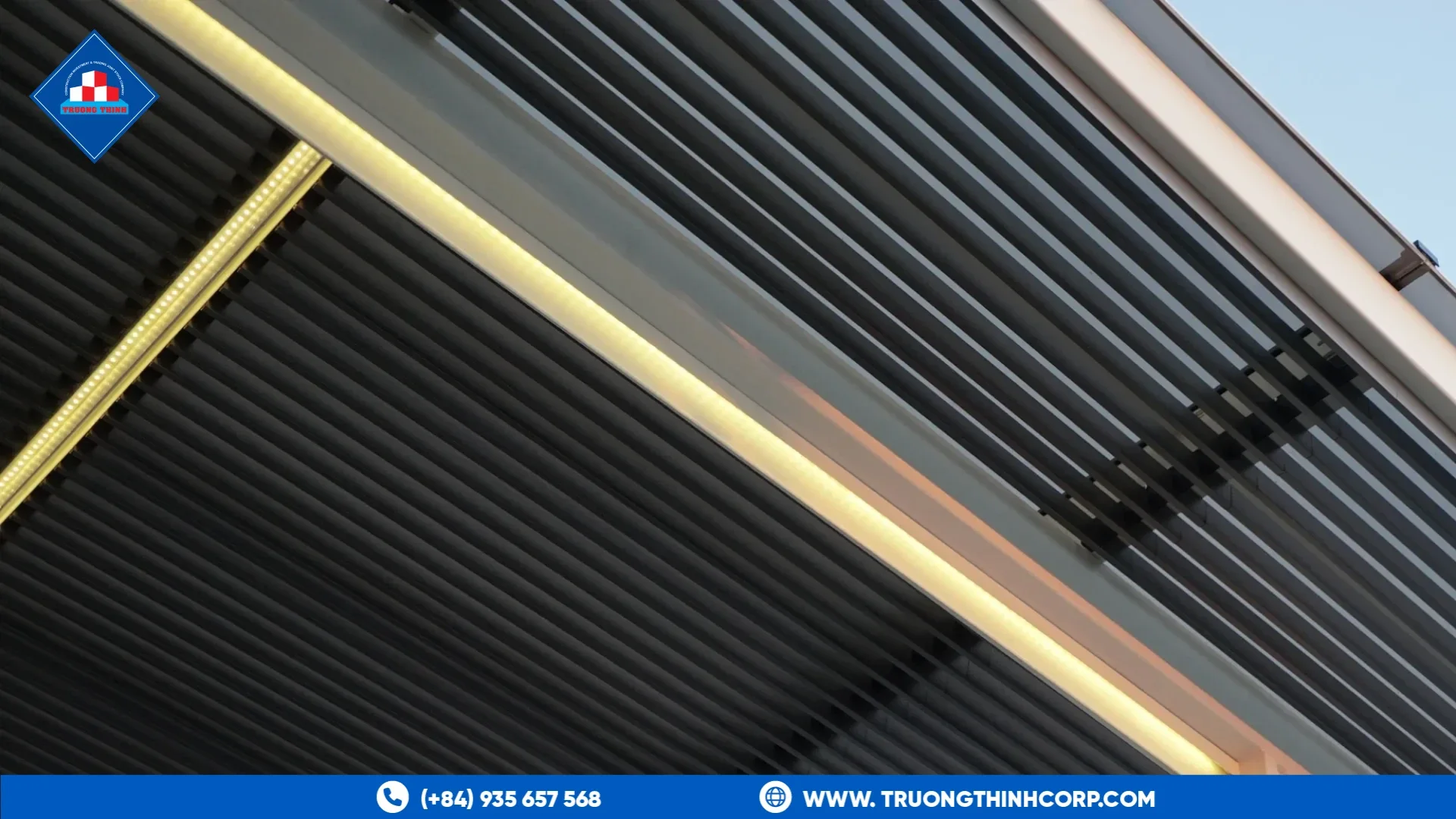 Underside of a metal-profile carport roof with an LED edge light, showing a cantilever canopy edge