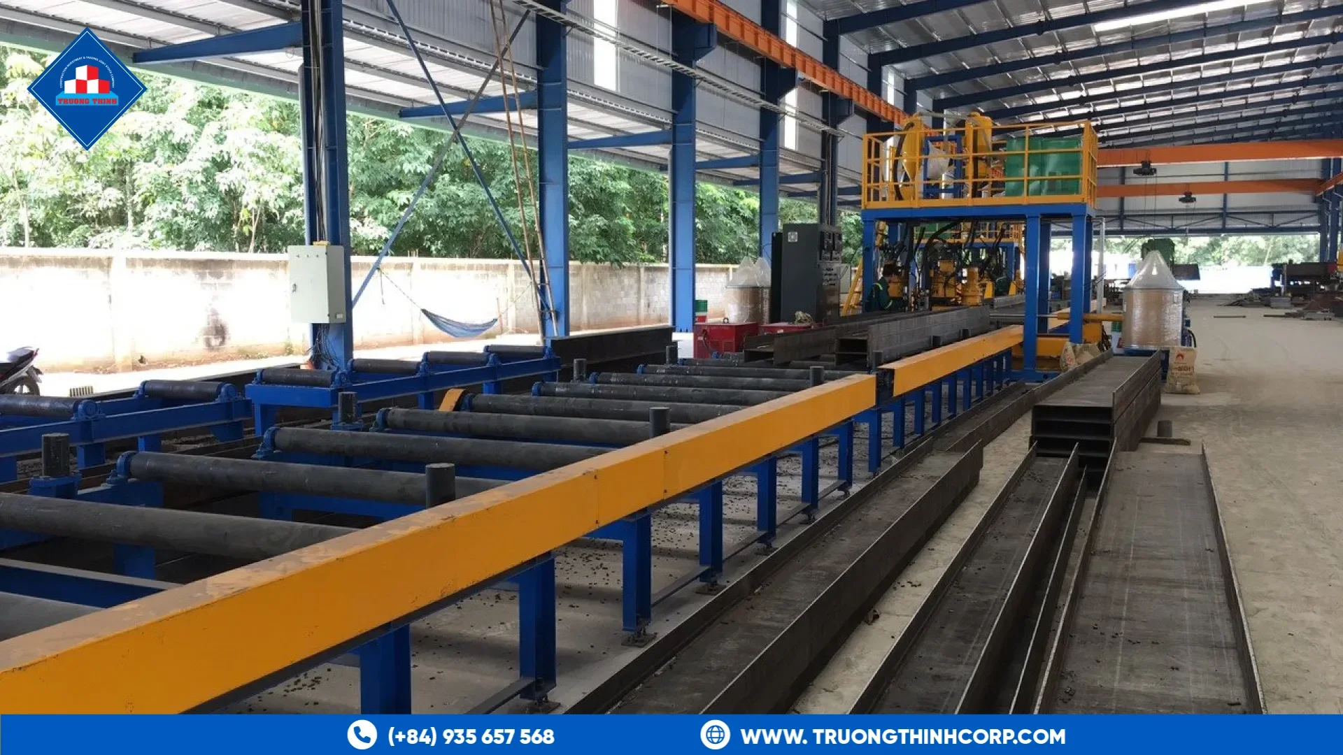 Beam assembly line with roller tables for fabricated steel sections at Truong Thinh Corp factory