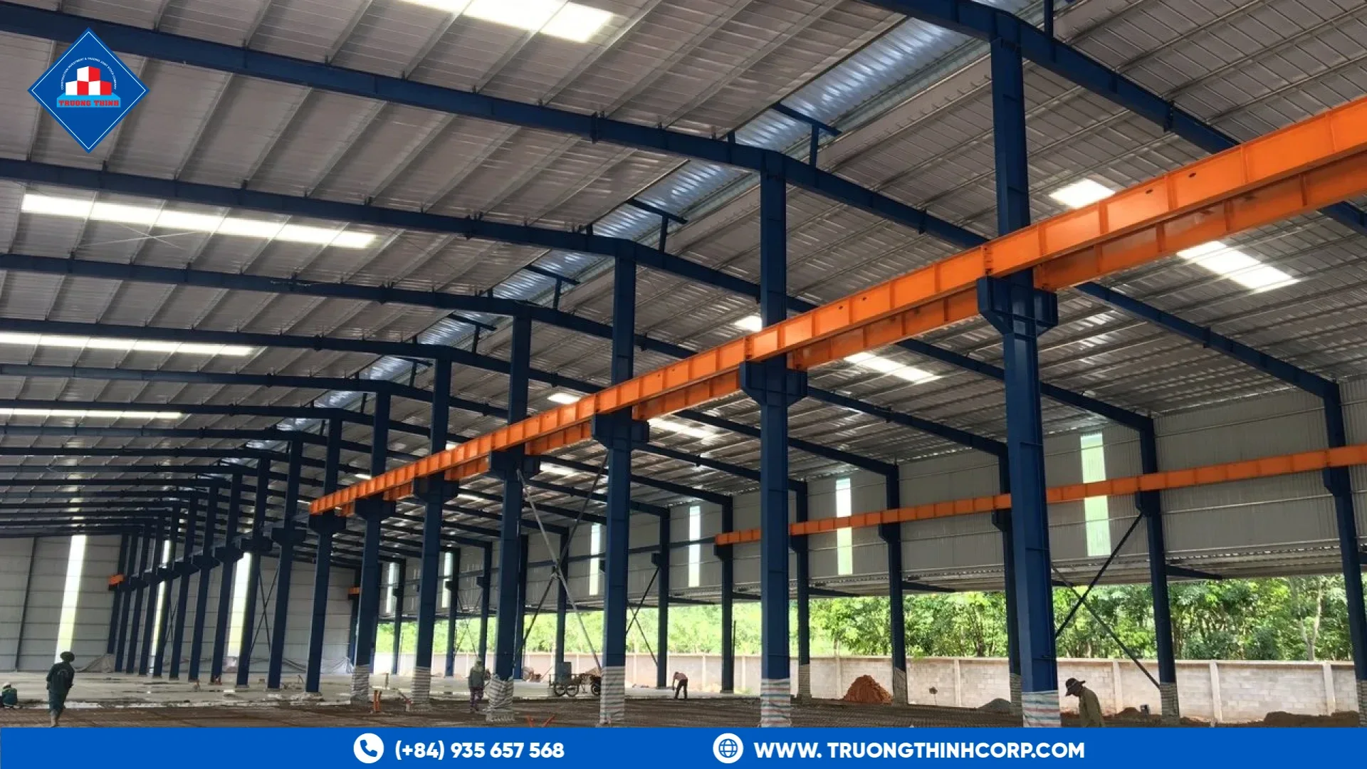 Steel fabrication factory floor with overhead cranes and long-span steel columns at Truong Thinh Corp