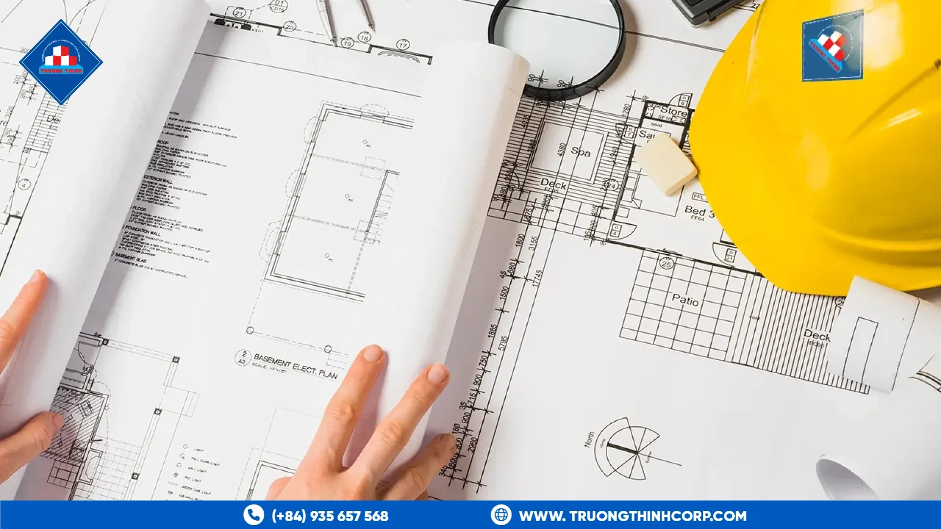 Structural blueprints and a safety helmet prepared for a steel structure RFQ