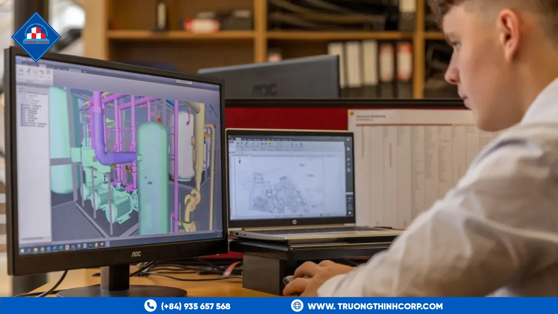 Engineer reviewing structural design data for steel fabrication coordination