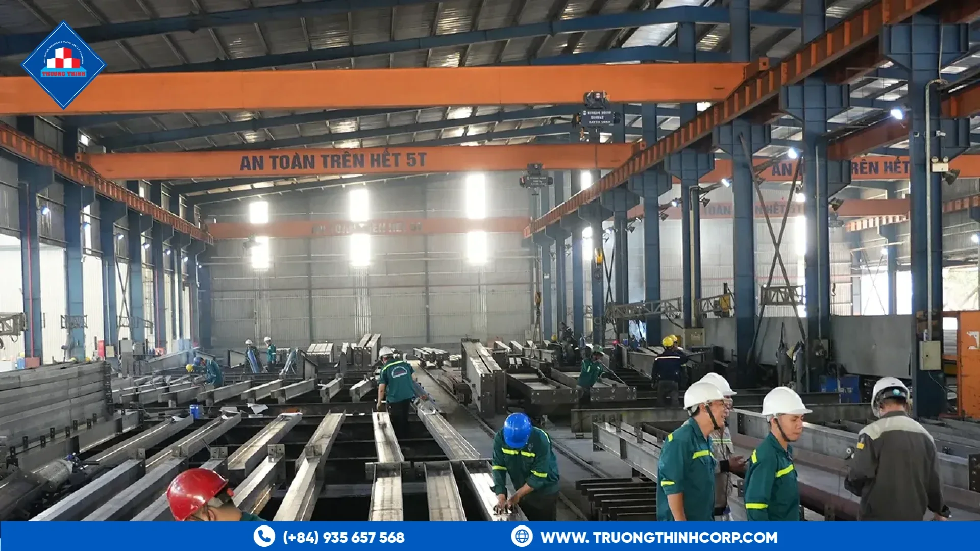 Factory team inspecting steel beams on a fabrication line at Truong Thinh Corp
