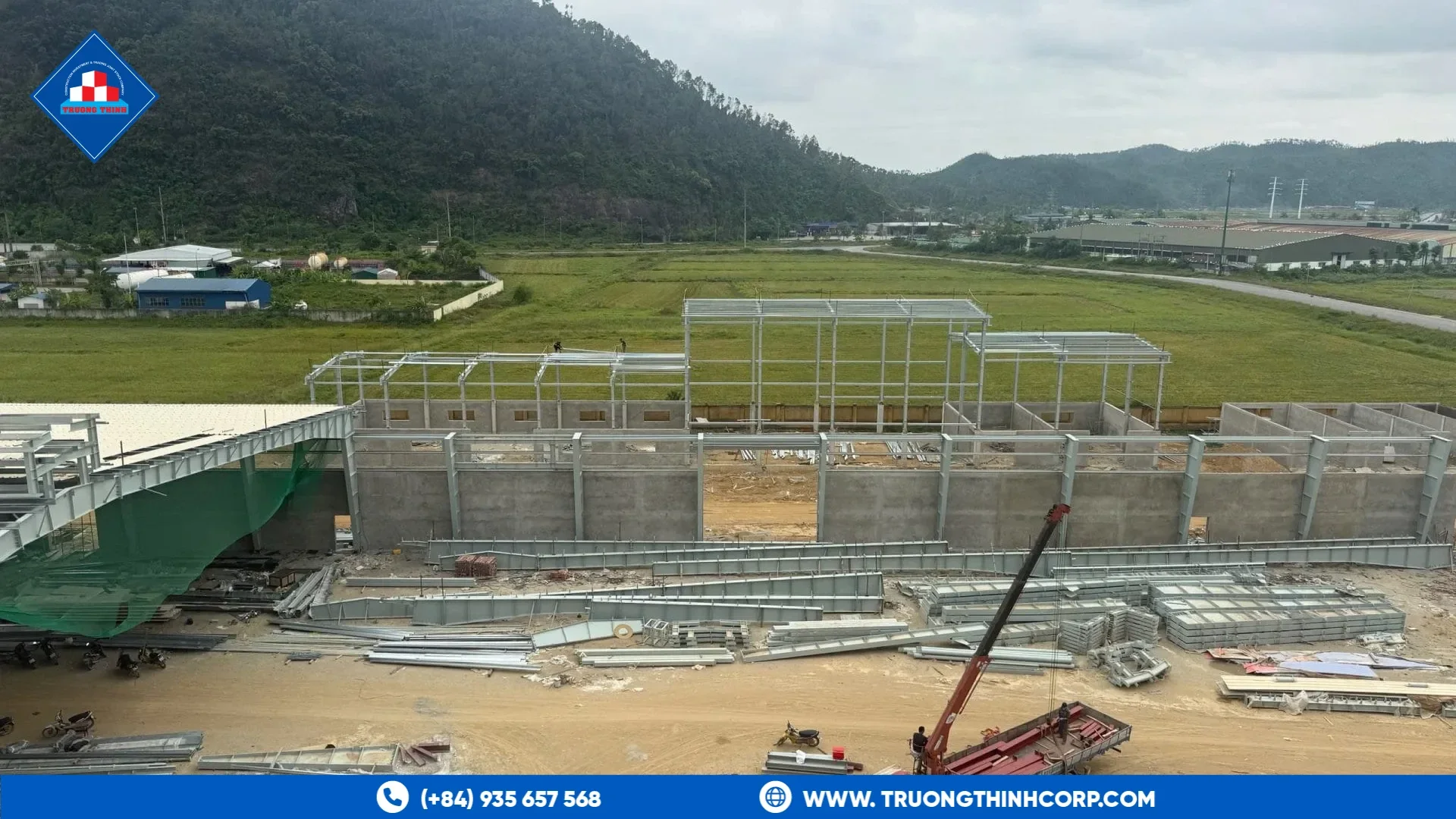 Steel structure site with a mobile crane, steel members and bracing on a Truong Thinh Corp project