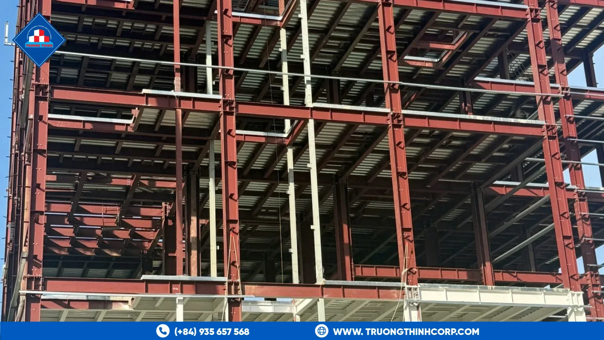 Multi-storey red steel frame with floors and bracing for an industrial building