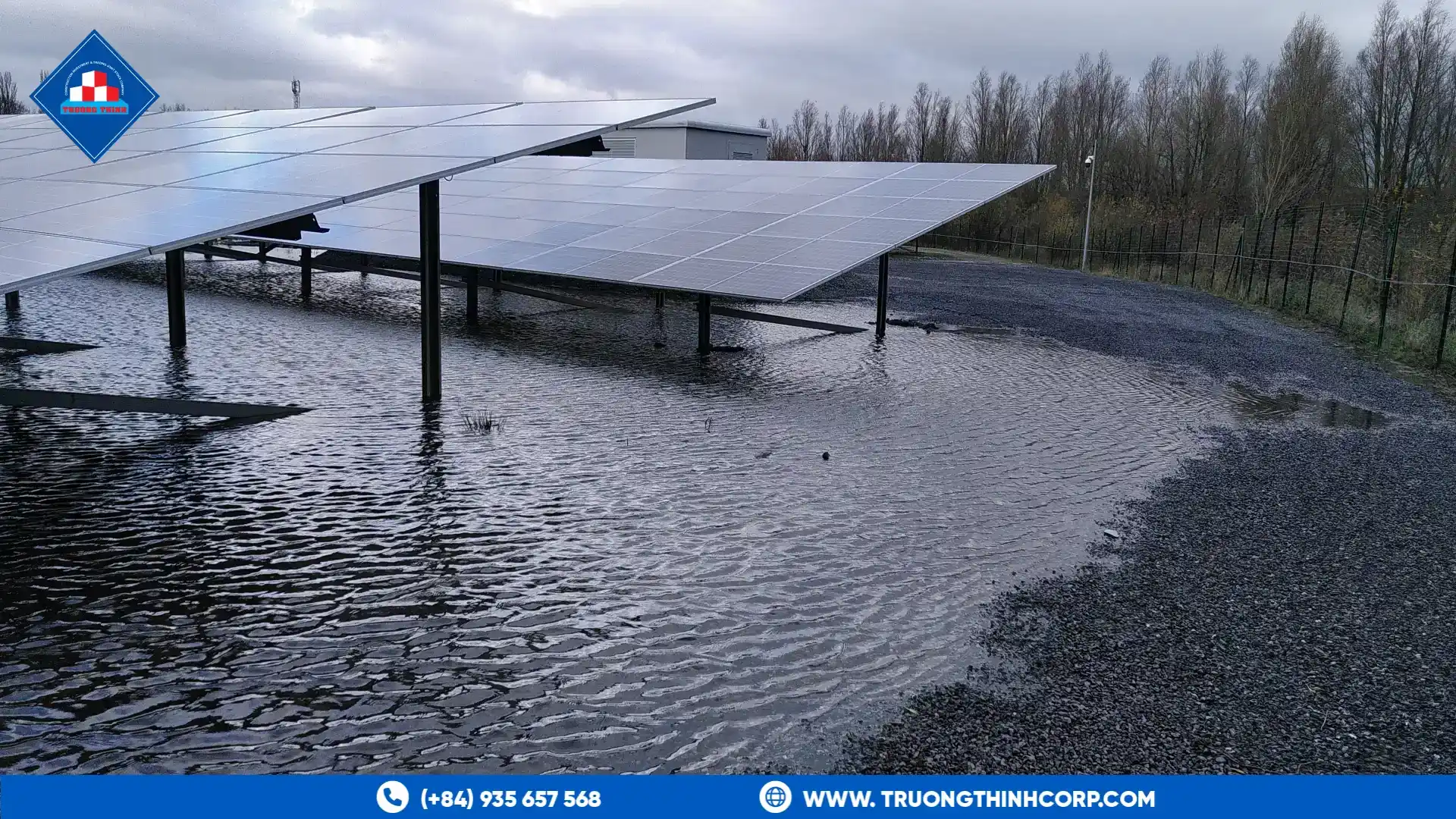 Solar panel mounting frames standing on wet ground, showing the steel posts and rails exposed to weather