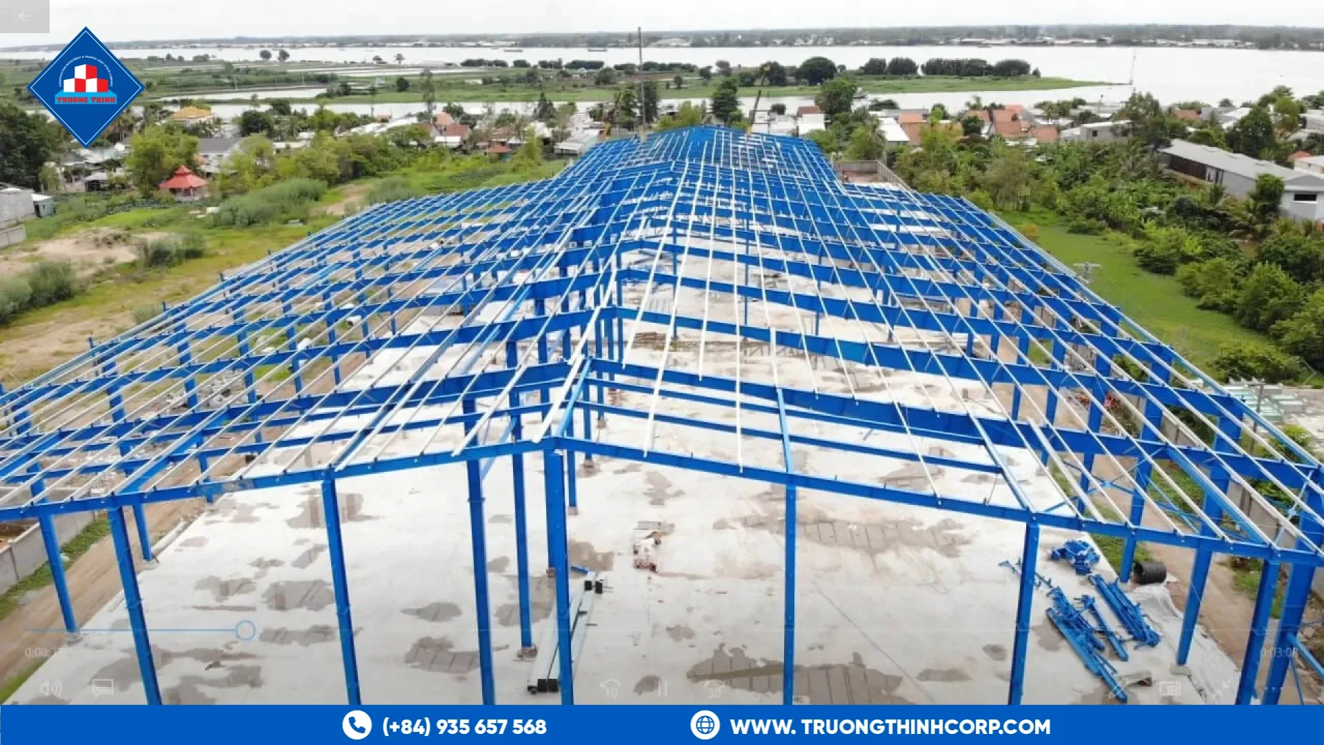 Blue steel frame of an open roofed structure under erection at a Truong Thinh Corp project
